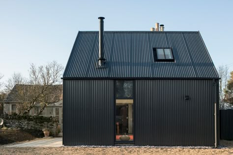 Corrugated metal extension by Eastabrook Architects | Detached houses Corrugated Metal Building, Corrugated Metal House, Modern Metal Building, Gravel Border, Corrugated Sheets, Structural Insulated Panels, House Cladding, Corrugated Roofing, Stone Cottages