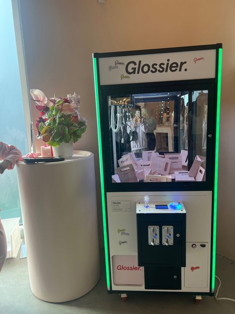 Wedding Claw Machine, Pop Up Brand Activation, Makeup Vending Machine, Clothes Pop Up Shop, Glossier Event, Glossier Merch, Claw Machine Aesthetic, Grab Machine, Brand Activation Ideas