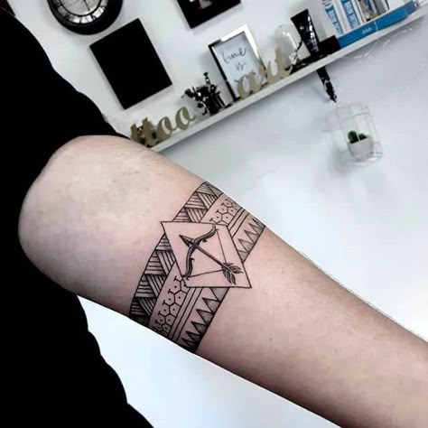 A bow and arrow tribal tattoo for men by @vilko_ink- Creative Sagittarius zodiac tattoo ideas Sagittarius Constellation Tattoo, Archery Tattoo, Sagittarius Tattoos, Mens Arrow Tattoo, Arrow Forearm Tattoo, Couple Wrist Tattoos, Sagittarius Tattoo Designs, Puzzle Tattoos, Blade Tattoo