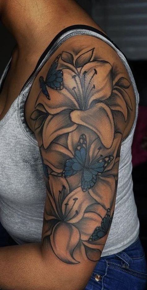 Garden Tattoos For Black Women, Half Sleeve Tattoos For Women Upper Arm Black Women, Red And Black Upper Arm Tattoo, Black Women Flower Tattoos, Female Flower Tattoos, Upper Arm Tattoos For Black Women, Tattoo Ideas Female Shoulder Black Women, Flower Shoulder Tattoo Black Women, Pretty Upper Arm Tattoos For Women