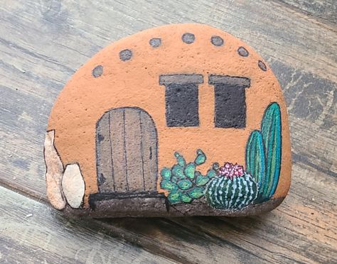 adobe painted rock home Painted Rock Houses, House Painted Rocks, Painted Fairy Rocks, Painted Rocks Fairy Houses, Fairy Garden Painted Rocks, Cottage Painted Rocks, Rock Village Painted, Mushroom Fairy House Painted Rocks, Painted Rock Fairy Garden