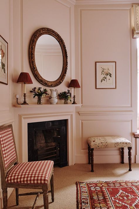 Pink and red makes for a warm colour scheme in the cosy sitting area of a [link url="http://www.houseandgarden.co.uk/interiors/bedroom"]bedroom[/link]. Hidden in a Somerset valley, this centuries old [link url="http://www.houseandgarden.co.uk/interiors/real-homes/restored-georgian-house-in-somerset"]house[/link] was an irresistible challenge for its owners, who put together a team including architect Ptolemy Dean for the painstaking restoration, which won a Georgian Group award in 2015. Like t Georgian Interiors, Warm Color Schemes, Georgian House, Bedroom Seating, Corner Fireplace, Georgian Homes, English Country House, Pink Room, Country House Decor