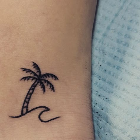 340+ Beach Tattoo Designs (2023) - TattoosBoyGirl Palm Tree Henna Tattoo, Palm And Wave Tattoo, Wave Tattoo With Palm Tree, Wave With Palm Tree Tattoo, Small Palm Tree And Wave Tattoo, Wave Tree Tattoo, Palm Tree Tattoo Minimalist, Little Palm Tree Tattoo, Palm Tree Wave Tattoo