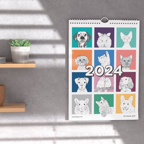 A mockup showing my A3 2024 Wall Calendar hanging on a grey wall, with sunlight coming through slatted blinds from the left. There are small wooden shelves on the left holding small succulent plants. The calendar is closed to the front cover, which shows a 3 x 3 grid of 9 different brightly coloured squares, each with a black & white digital illustration of the head & shoulders of a pet animal! Including a Corgi dog on yellow, a Kitten on powder blue, a Chinchilla on grey, and a Yorkie on pink. Lionhead Rabbit, Calendar Cute, A4 Prints, Silk Paper, Three Cats, Paper Ship, Backing Card, Calendar Design, Animal Faces