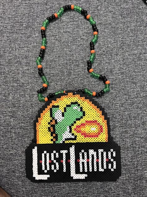 Lost Lands Yoshi Perler Necklace Choose to have Yoshi in green, red or blue This will be made into a necklace ** Some warping may occur depending on different color beads or in uncontrollable environments Lost Land Perler, Lost Lands Kandi, Lost Lands Perler, Festival Trinkets, Rave Perler Ideas, Rave Perler Pattern, Perler Charms, Perler Bead Necklace, Rave Perler