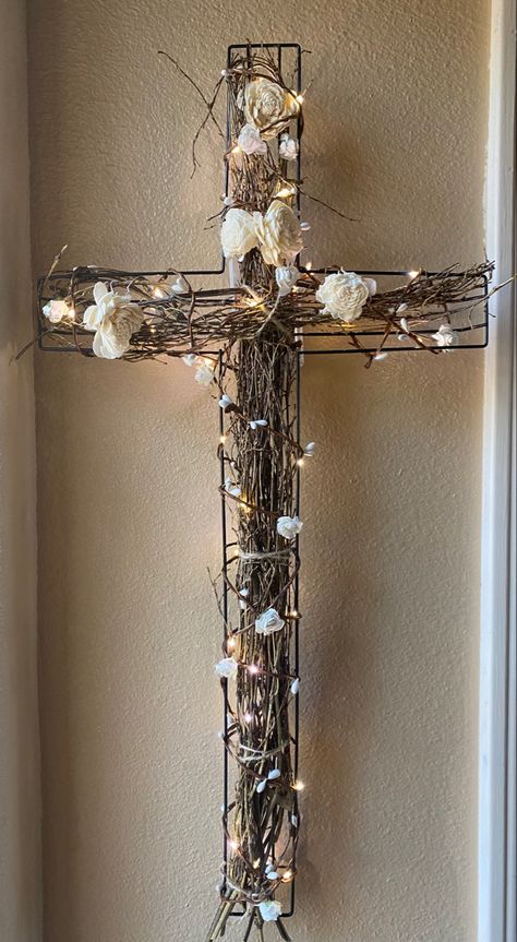 Metal cross with twine, wood flowers, wrapped with lighted copper wire with flowers. In colors/shades of whites, greens and browns. 24”high 12” wide, 2” deep How To Decorate A Wire Cross From Dollar Tree, Wire Crosses Diy How To Make, Dollar Tree Wire Cross Wreath Diy, Wire Crosses Diy, Diy Cross Decor, Wreaths For Funerals, Wired Art, Cross Wreath Diy, Wooden Cross Crafts