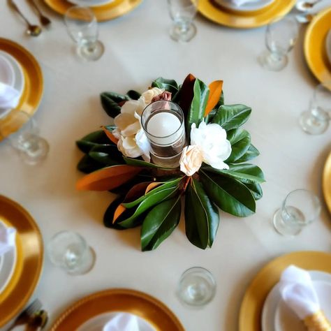 Bold & Belle Designs | These Magnolia centerpieces are just simply gorgeous! 🥰 Created with Fresh Atlanta Magnolia leaves to add a bit of the Southern Beauty to … | Instagram Decorate With Magnolia Leaves, Magnolia Leaves Table Runner, Magnolia Wedding Flowers Centerpieces, Magnolia Greenery Wedding, Magnolia Centerpiece Floral Arrangements, Magnolia Wedding Decor, Magnolia Themed Party, Magnolia Centerpiece Wedding, Magnolia Wedding Decorations