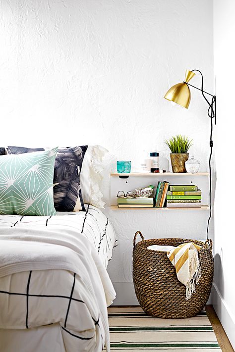 Stop throwing extra bed pillows or blankets on the floor every night. Instead, toss pillows in a wicker storage basket at bedtime to help keep them clean and off the floor. #storage #basketstorageideas #bedroom #organizationtips #bhg Nightstand Alternative, Small Bedroom Organization, Small Bedroom Storage, Storage Solutions Bedroom, Bedroom Organization Storage, Small Space Bedroom, Revere Pewter, Night Stands, Trendy Bedroom