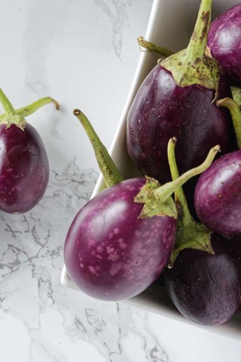 Eggplant is sensitive to temperature, so it's important to learn how to store it properly. See how to store eggplant at room temperature and in the fridge, plus the right way to freeze it. #foodhacks #kitchenhacks #lifehacks #marthastewart #recipehacks How To Store Eggplant, Entertaining Dinner, July Holidays, Wedding Party Planning, Container Gardening Flowers, Eggplant Recipes, Holiday Planning, Holiday Entertaining, Breakfast Brunch Recipes