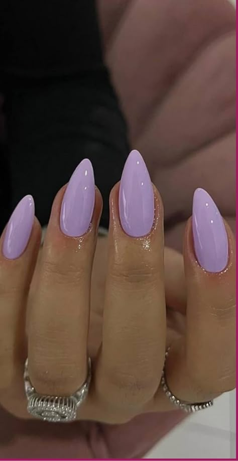 Indulge in the sophistication of Purple Almond Acrylic Nails! Let the allure of this elegant design sweep you off your feet. The almond shape brings a touch of femininity, while the mysterious and luxurious purple shade adds a unique charm. These nails are perfect for those who crave attention and love to express their individual style. Whether you prefer a glossy finish or want to sparkle with glitter accents, these Purple Almond Acrylic Nails will take your manicure to the next level. Almond Shape Lavender Nails, Light Purple Nail Ideas Almond, Wedding Nails Lilac, Lilac Almond Acrylic Nails, Narrow Almond Nails, Almond Nails Lilac, Nail Designs Almond Shape Ideas, Light Purple Glitter Nails, Purple Acrylic Nails Almond