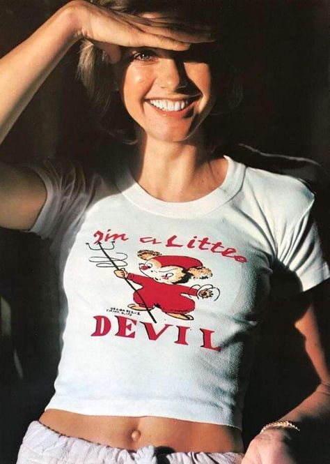 Olivia Newton John rocking a' I'm a little devil shirt' Olivia Newton John Young, 70s Lookbook, Her Poster, Sandra Dee, Olivia Newton, Olivia Newton John, Farrah Fawcett, Retro Nostalgia, John Travolta