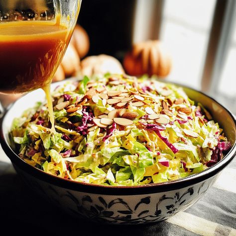 Cranberry Almond Thanksgiving Slaw combines cabbage, dried cranberries, and almonds in a tangy vinaigrette for a festive side dish. Thanksgiving Slaw, Thanksgiving Salad, Slaw Recipe, Cranberry Almond, Slaw Recipes, Green Cabbage, Spanish Onion, Dried Cranberries, Coleslaw