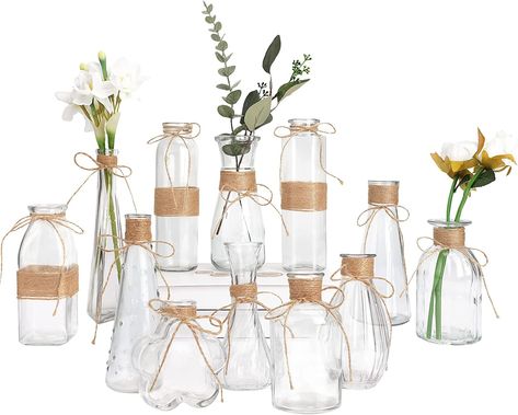 Store New Arrivals Add to Favorite View Feedback Contact CUCUMI Small Bud Vases for Flowers Set of 12, Mini Clear Glass Vases Bulk for Rustic Wedding Decorations, Vintage Flower Vase with Rope Design for Table Centerpieces Party Home Decor Description Item model number 2021101501 Room Type Bathroom, Dining Room Color Green Brand CUCUMI Material Glass Country of Origin China Shape Different Shapes Item Weight 6.76 pounds Installation Type Centerpieces,Tabletop Theme Flower,Flowers Occasion Wedding, Graduation, Christmas, Mother s Day Number of Pieces 12 Special Feature Durability Product Dimensions 15.2"L x 6.8"W x 10.7"H : Contains 12 bud vases of different shapes. These decorative vintage glass vases are attractive and can be used in any setting from elegant to simply casual. You can use Vasos Vintage, Glass Vases Centerpieces, Vases For Flowers, Deco Champetre, Tafel Decor, Small Glass Vases, Flower Bottle, Clear Vases, Rustic Vase