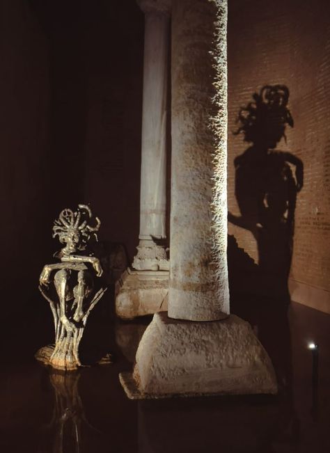 The bases of two columns In the northwest corner of the cistern reuse blocks carved with the face of Medusa. The origin of the two heads is unknown, though it is thought that they were brought to the cistern after being removed from a building of the late Roman period. Basilica Cistern, Blue Mosque, Ancient Sculpture, Hagia Sophia, Ancient Architecture, Modern Sculpture, Music Photography, Iconic Landmarks, Istanbul Turkey