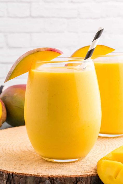 This delicious Mango Lassi recipe makes a refreshing drink with simple ingredients in just 10 minutes, perfect for hot summer days! With a blend of yogurt, sweet mangoes, fresh mango juice, honey, cardamom, vanilla, and ice, this tropical beverage is packed with delicious fruity flavor! #mangoes #lassi #mangolassi #beverage #drink #mangolassirecipe Best Mango Lassi Recipe, Homemade Punch, Mango Lassi Recipe, Strawberry Lassi, Mango Lassi Recipes, Lassi Recipe, Thai Mango, Almond Milk Yogurt, Lassi Recipes