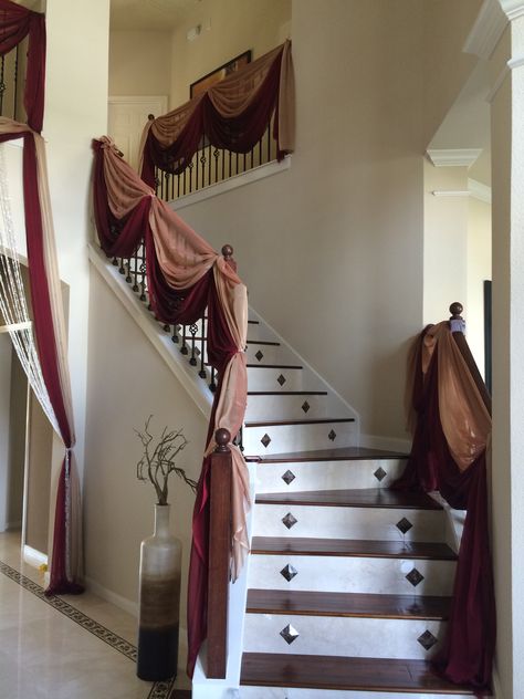 Gold & Burgundy Staircase Draping Burgundy Staircase, Wedding Staircase Decoration Railings, Stairwell Decor, Hope Decor, Event Draping, Stairs Canopy, Wedding Staircase, Lakshmi Puja, Fall Lake