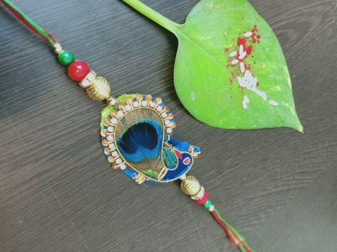 Peacock Rakhi, Rakhi Diy, Diya Decoration Ideas, Diya Decoration, Rakhi Making, Hand Reflexology, Handmade Rakhi, Handmade Paintings, Diy Paper Crafts Decoration