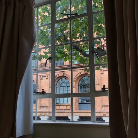 A view, with curtains on both sides, of the window that shows another building London View From Window, Hotel Room Window, Feels Aesthetic, London Hotel Room, Boutique Art, Aesthetic London, London Hotel, London View, Victorian London