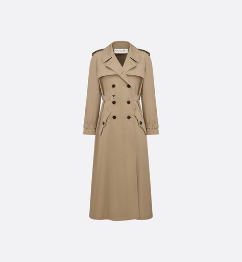 The beige trench coat presents a refined new take on an essential wardrobe piece. Crafted in cotton, it is enhanced by a contrasting embroidered bee on the front, a key symbol of the House. The adjustable side placket highlights the waist, while topstitched details and pointed pockets with buttoned flaps create a sophisticated look. The trench coat may be paired with any piece for a casual or elegant look. Essential Wardrobe Pieces, Trench Beige, Beige Trench Coat, Christian Dior Couture, Dior Couture, The Paradise, Boutique Online, Look Casual, Lady Dior