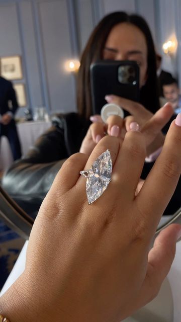 CHAMPAGNE GEM®️ by Bebe on Instagram: "the grand beauty of marquise! an alluring 23-carat D VS1 type IIa marquise-cut diamond solitaire ring with delicate diamond encrusted details through the basket and band, seen few month ago at @christiesjewels magnificent jewels which sold for over $1 million. <> #MyLoveAffairWithDiamonds #MagnifiqueMarquise #Fire #MarquiseCut #Brilliance #Scintillation #Sparkle #Bridal #EngagementRing #HighJewelry #Christies #ChristiesJewels #ChampagneGemGoesToGeneva #Cham Engagement Rings With Band, Treasure Hoard, 2025 Bride, Dream Wedding Ring, Magnificent Jewels, Marquise Cut Engagement Ring, Marquise Diamond Engagement Ring, High Jewelry Ring, Marquise Diamond Ring