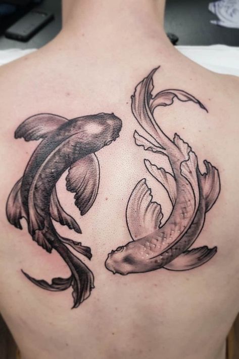 Amazing koi fish back tattoo done by @katarina.heinze, with the thicker lines and black and grey realism. Koi Fish Knee Tattoo, Coy Fish Tattoo Men, Coi Fish Tattoo Design Black And Grey, Koi Fish Tattoo Design Black And Grey, Chest Tattoo Text, Mens Koi Fish Tattoo, Black And Gray Koi Fish Tattoo, Koi Fish Tattoo Forearm, Tattoo On Hip Bone