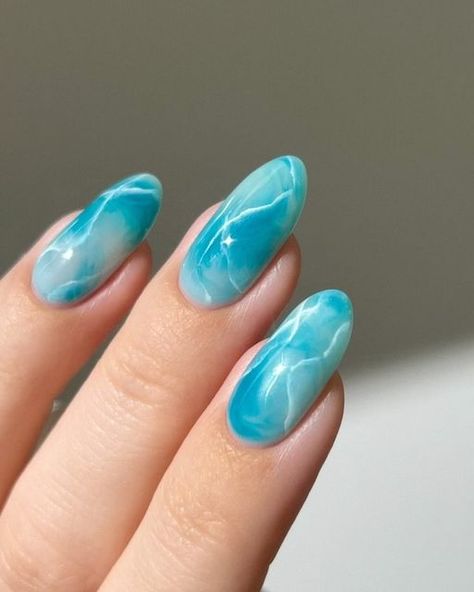 Aistė ❣︎ on Instagram: "🐬🫧 obsessing over marble nails lately :) and I love how bold and vibrant this teal color is !!  Using: @gelcare.official Coconut Milk | Jelly Teal | French Alps | Blooming Gel || For 15% off use code: AISTE _____ (*aff) #greennails #bluenails #marblenails #tealnails #pastelnails #springnails #nails #nailinspo #nailart  gradient ombre marbles, cute nails , almond nails , nail art tutorial," Marble Nails Teal, Green Blue Nails Ideas, Water Blue Nails, Blooming Gel Marble Nails, Teal Marble Nails, Blue Teal Nails, Water Effect Nails, Coconut Nails, Teal Blue Nails