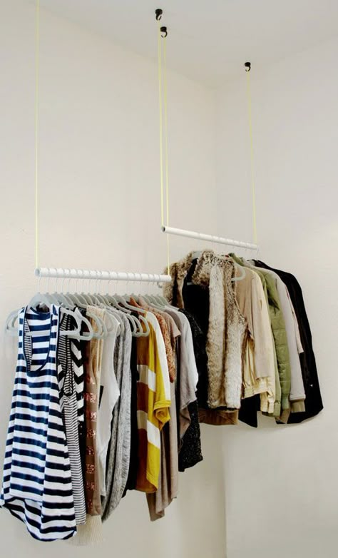 This idea's a little high-concept, but can help fill any closet efficiently. The differing heights separate clothes by type, and ensure longer items won't drag on the floor. Get the tutorial at The Design Confidential »   - HouseBeautiful.com Small Coat Closet, Diy Clothes Rack, Closet Hacks Organizing, Closet Rods, Clothes Closet Organization, Clothes Hanging, Open Closet, Small Closets, Closet Organization Diy