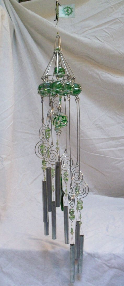 Handcrafted large & heavy (4 1/2 lbs) aluminum, glass balls with swirled green color, and acrylic beads wind chime. Total length including the hanging chain and chimes is 39". total length without the hanger length is 32". Diameter of the top ball circle is 6". Aluminum tubes are 5". Star is 4". Largest ball is 2". New with original tags from Care & Wonder Company, Inc. based in California. Windchimes Homemade, Handmade Windchimes, Capiz Wind Chimes, Windchimes Diy, Moon Wind Chimes, Wind Chimes For Sale, Large Wind Chimes, Glass Bead Crafts, Wine Bottle Wind Chimes