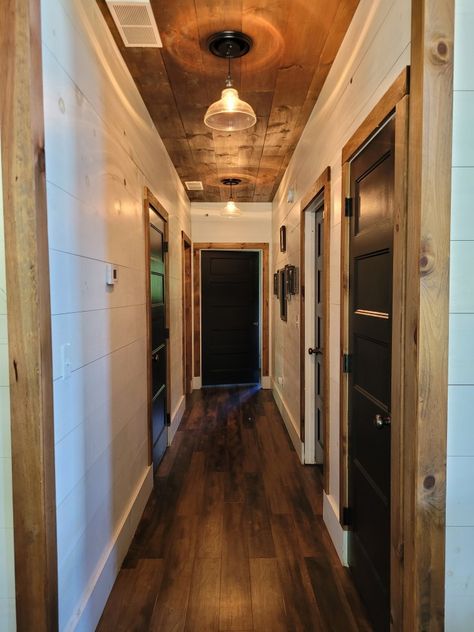 Shiplap obsessed 😍 Shiplap Hallway, Stained Shiplap, White Hall, Garage Doors, Stain, Fireplace, Black And White, White, Outdoor Decor