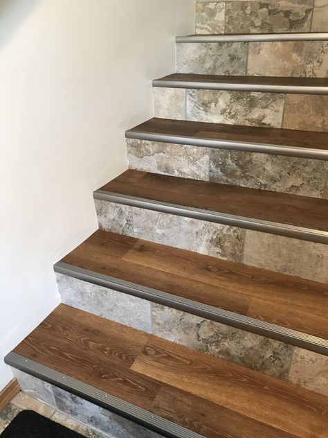 My stairs finally finished! Luxury Vinyl Plank on the treads, which matches the upstairs rooms. Porcelain tile on the risers, which matches the Den, Foyer and Baths. Schluter stair nosing for a transitional look. Tile For Stairs Staircases, Wood Look Tile Stairs, Stair Nosing Ideas, Indoor Steps Ideas Stairs, Vinyl Plank Flooring Stairs, Travertine Stairs, Tiles For Stairs, Tiles Stairs, Laminate Flooring On Stairs