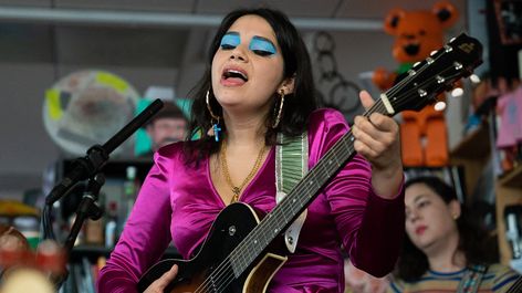 With a great deal of "Salva-Mex-American" pride, Angelica Garcia performs three songs from her album, Cha Cha Palace at the Tiny Desk. Angelica Garcia, Ryan Jones, Tiny Desk Concert, Tiny Desk, Tiny Desks, Audio Engineer, Fuchsia Dress, She Song, American Pride