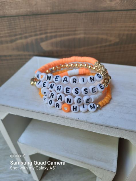 Im wearing Tennessee for him stacked bracelet set Morgan Wallen Clay Bead Bracelet Ideas, Morgan Wallen Beaded Bracelets, Southern Bracelets, Morgan Wallen Bracelet, Morgan Wallen Clay Bead Bracelet, Zach Bryan Bracelet Ideas, Tennessee Clay Bead Bracelets, Word Bracelet Ideas, Morgan Wallen Bracelet Ideas