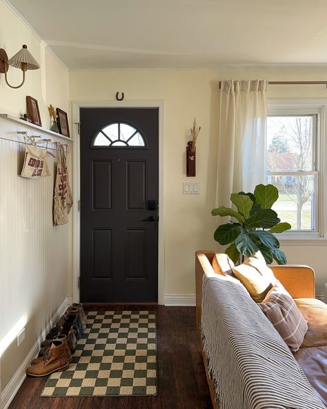 Our makeshift entryway 🚪 Thinking I’ll probably paint the trim in here beige at some point like we did in the nursery! Also forever… | Instagram Moody Neutrals, Kayla Jean, Apartment Makeover, Cabin Style, Colmar, Exterior Door, Dream Spaces, Home Room Design, Florida Home