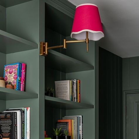 Sarah Southwell Design on Instagram: "This is the new study in @bryonygordon’s london townhouse, this space was heaven to design. It was originally a bedroom but we panelled all the walls in the room with tongue and groove and then built in shelves for all the books they have along one wall. I love the green @farrowandball paint against the bright pink @mavericksoulinteriors lamp shade and these amazing candle sticks by @amyrhianstudio. I am very lucky as I can visualise rooms before they are created but this one turned out even better than I had imagined in my mind. One of my favourites from the project. 💚💕 

#study
#office
#londonloftconversion 
#sarahsouthwelldesign" London Townhouse, Candle Sticks, Loft Conversion, Tongue And Groove, Built In Shelves, Study Office, Best Candles, My Mind, Bright Pink