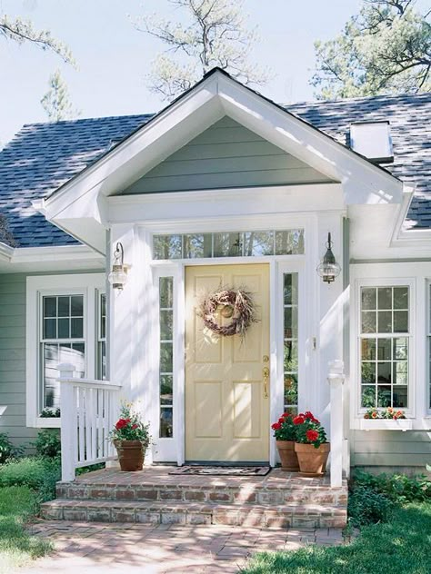 We love this pale yellow door! 19 more ways to improve your curb appeal: http://www.bhg.com/home-improvement/exteriors/curb-appeal/ways-to-add-curb-appeal/?socsrc=bhgpin071712yellowfrontdoor#page=3 Front Porch Design Ideas, Front Porch Remodel, Veranda Design, Front Door Inspiration, Porch Design Ideas, Porch Remodel, Yellow Door, Pintura Exterior, Front Porch Design