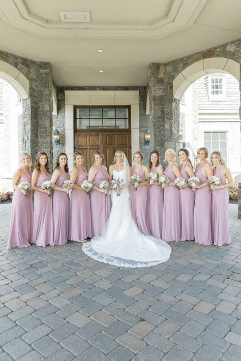 Feel The Love At This Elegant Wedding With A Huge Bridal Party #bridesmaiddresses #lilacbridesmaids #bridalparty #bigbridalparty #weddingdresstrain Simple White Wedding Dress, Plain White Dress, Wedding Dress Train, Table Number Cards, Future Bride, Long Train, White Wedding Dresses, Reception Rooms, Gorgeous Wedding