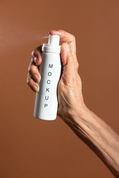 Hand holding a white aerosol spray bottle mockup | premium image by rawpixel.com / Jira Beauty Products Mockup, 2024 Photoshoot, Small Perfume Bottles, Stop Motion Photography, Cooling Spray, Hand Spray, Motion Photography, Aerosol Spray, Brown Bottles