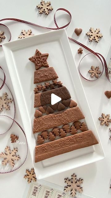 Manu - Manuela Pezzopane on Instagram: "One more version of my Christmas cookie platter that | designed in 2019. In this video, I used a rolling pin to emboss the cookie dough and that’s the only decoration for the cookies. 

You’ll find this rolling pin only at @cocoro_home, with the exclusive illustrations by @le_facciotte.

You can read my original cookie project tutorial (cookies decorated with royal icing - photo at the end of the video)on Cookie Connection: Made by Manu, November 2019, step-by-step tutorial. Link in bio or in the story highlights under “XMas Tutorial”.

(Use of the logo Cookie Connection is courtesy and copyright of @juliamusher)

🤎 🤎 🤎

Una versione solo di pasta frolla al cacao della mia composizione di biscotti a forma di alberello di Natale, disegnata e realiz Cookies Decorated With Royal Icing, Cookie Platter, Cookie Connection, Royal Icing Decorations, Christmas Cookies Decorated, Cookies Decorated, Christmas Cookie, Story Highlights, Decorated Cookies