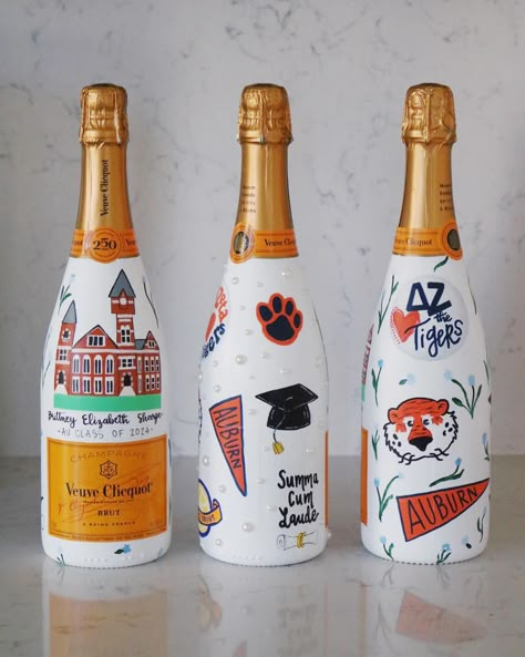 Just wrapped up round one of hand painted grad bottles 🍾🧡 A few more to go!!! College Painted Champagne Bottle, Hand Painted Wine Bottles Ideas, College Champagne Bottle, Painted Champagne Bottle Graduation, Painted Alcohol Bottles, Painted Bottles Ideas, Painted Champagne Bottles, Wine Bottle Painting, Bottles Painting