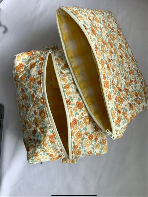 Yellow and orange floral quilted makeup bag and pouch Sewed Makeup Bags, Quilted Makeup Pouch, Quilted Make Up Bag, Homemade Makeup Bag, Quilted Makeup Bag Pattern, Sewn Makeup Bag, Diy Quilted Makeup Bag, Sew Makeup Bag, Makeup Pouch Pattern