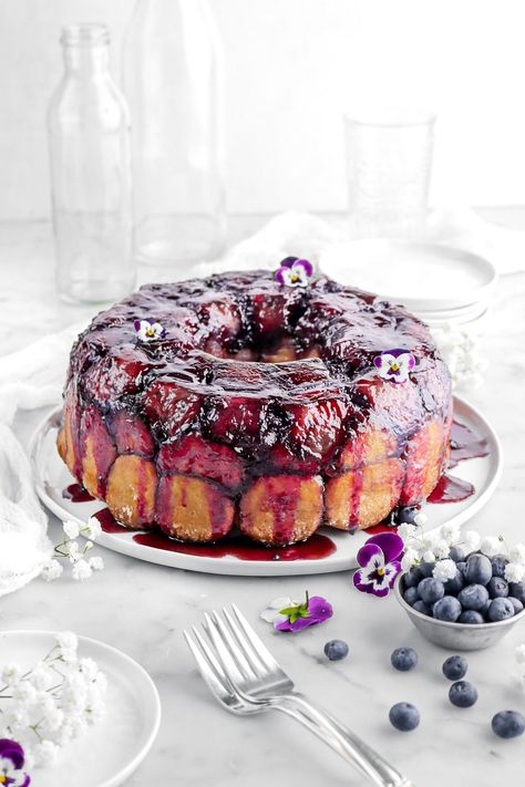 Indulge in the ultimate pull-apart bread recipe with our gooey and delicious Lemon Blueberry Monkey Bread! This delightful twist on a classic promises a burst of citrusy sweetness in every bite. Whether for brunch, a sweet snack, or a show-stopping dessert, this monkey bread is the perfect treat to share with friends and family! Blueberry Monkey Bread, Lemon Monkey Bread, Breakfast Brunch Party, Homemade Blueberry Syrup, Bread Pull Apart Recipes, Bakers Table, Breakfast Meat, Blueberry Syrup, Sweet Dough