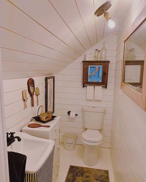 19 Attic Bathroom Ideas We Want to Copy Small Dormer Bathroom Ideas, Slopped Roof Bathroom, Tiny Attic Bathroom Ideas Slanted Ceiling, Low Sloped Ceiling Bathroom, Half Bath With Slanted Ceiling, Slant Ceiling Bathroom, Short Ceiling Bathroom, Cape Cod Bathroom Ideas Sloped Ceiling, Slanted Wall Bathroom