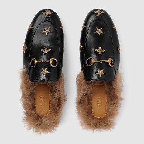 Shop the Princetown embroidered leather slipper by Gucci. Since its debut in the Fall Winter 2015 collection, the Princetown slipper has become a mainstay of Gucci collections. Unconventional yet entirely modern, the influential accessory is a contemporary interpretation of the Horsebit loafer. Updated for Cruise 2018 in leather embroidered with gold thread bees and stars. Gucci Princetown Slipper, Gucci Princetown, Shoes Fashion Photography, Fur Mules, Half Shoes, Size 11 Women Shoes, Gucci Store, Designer Slippers, Embroidered Leather