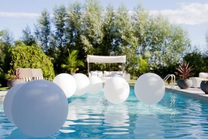 10 Themed Pool Party Ideas for Summer | Decorating and Design Blog | HGTV Hotel Pool Party, Hawaiian Decorations, Hamptons Party, Swimming Pool Decorations, Pool Party Ideas, White Party Theme, Backyard Pool Parties, Pool Party Themes, Pool Party Decorations