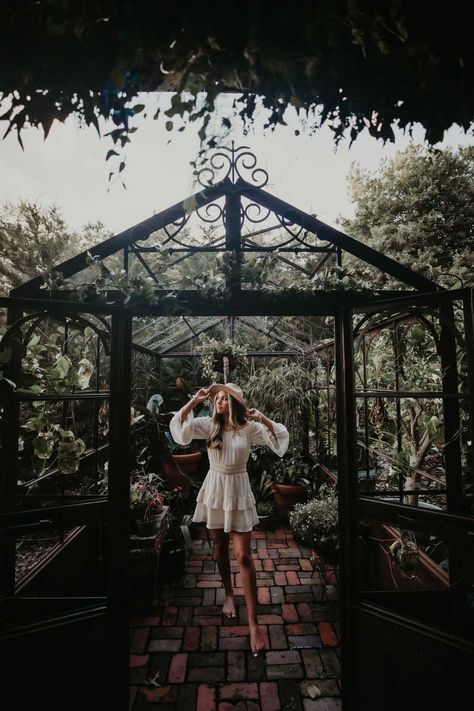 Greenhouse Senior Pictures Boho Hat Dress Photoshoot ideas Plants Barefoot Picture inspo Green House Picture Ideas, Indoor Garden Photoshoot, Greenhouse Photoshoot Outfit, Greenhouse Photoshoot Ideas, Senior Photos Greenhouse, Senior Pictures Greenhouse, Garden Center Photoshoot, Greenhouse Picture Ideas, Senior Picture Ideas Greenhouse