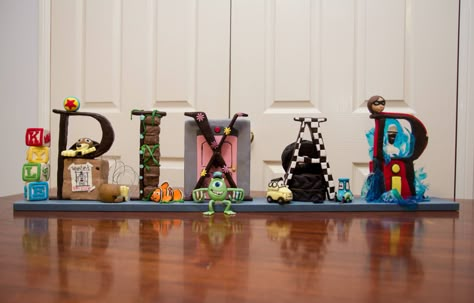 My Mum made an awesome Disney Pixar birthday cake Pixar Cakes Ideas, Disney Pixar Birthday Party Ideas, Pixar Theme Birthday Party, Vampirina Cupcakes, Pixar Baby Shower Ideas, Pixar Birthday Cake, Pixar Birthday Party Ideas, Pixar Party Ideas, Pixar Birthday Party