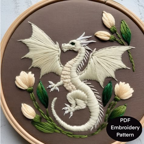 Hand Embroidery pattern template for a fantasy dragon with floral  elements. The pattern is available in 3.4,5,6,7,8 and A4 sizing to fit a variety of embroidery hoops. This digital download is for the pattern only as no instructions are included for stitching or for thread types or colors other than the reference photo of the design. What's Included  🪡 Digital PDF file suitable for printing at home or at a copy shop 🪡 Basic stitches for embroidery "how-to" sheet 🪡 How to transfer designs usi Fabric Bag Design, Medieval Embroidery, Crewel Embroidery Patterns, Dragon Embroidery, Simple Hand Embroidery Patterns, Embroidery Template, Embroidery Stitches Tutorial, Hand Embroidery Projects, Hand Embroidery Design Patterns