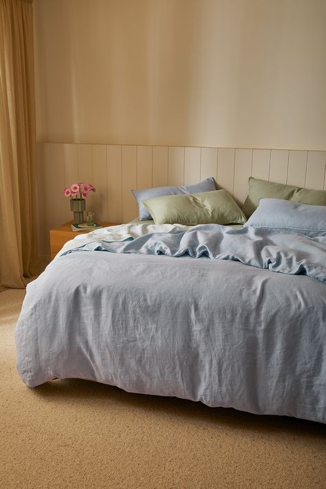 Styled with our Eve Linen in Sage, Sky and Powder Blue creating a cool and classic look. Light Blue Linen Bedding, Blue Sage Bedroom, Blue Linen Bedroom, Blue Linen Sheets, Cornflower Blue Bedding, Green Blue And White Bedroom, Beachy Plants, Light Blue Bedding Ideas, Light Blue Bed Sheets