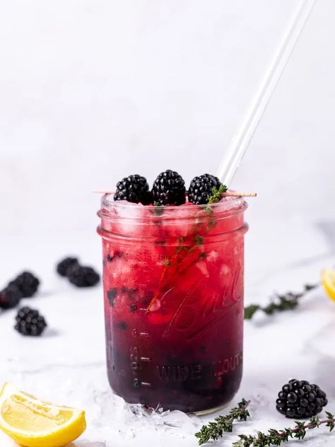 Refreshing Smashed Blackberry Mocktail Recipe Blackberry Mocktail Recipes, Thyme Simple Syrup, Easy Mocktail Recipes, Sparkling Mineral Water, Italian Soda, Blackberry Jam, Mocktail Recipe, Fresh Lime, Delicious Cocktails