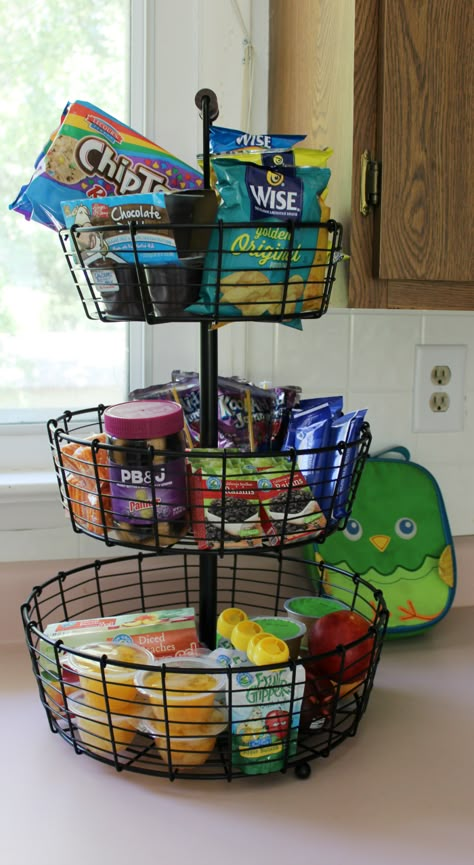 Lunch Packing Station. #savealotinsiders Snack Holder Ideas For Kitchen, Kids Summer Snack Station, Snacks Storage Ideas, Countertop Snack Organization, Office Food Station, Lunch Station For Kids, Snack Organization Ideas Counter, Countertop Snack Storage Ideas, Grab And Go Breakfast Station